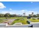 Water view from porch showcasing a picturesque landscape and palm trees, offering a serene outdoor setting at 108 Shore Dr, Tarpon Springs, FL 34689