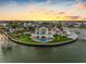 Waterfront home boasting a private pool, lush lawn, and access to a boat dock at 11000 8Th E St, Treasure Island, FL 33706