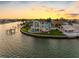 Waterfront home with pool, dock, and manicured lawn in a coastal neighborhood at 11000 8Th E St, Treasure Island, FL 33706