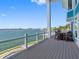Spacious balcony provides plenty of room to relax and admire beautiful water views at 11000 8Th E St, Treasure Island, FL 33706