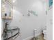 Nautical-themed half bathroom with a glass vessel sink, decorative accents, and stylish fixtures at 11000 8Th E St, Treasure Island, FL 33706