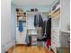 Spacious walk-in closet with custom shelving, hanging rods, and drawers for optimal storage in this home at 11000 8Th E St, Treasure Island, FL 33706