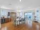 Bright dining area with seating for six, water views, wet bar and access to the deck at 11000 8Th E St, Treasure Island, FL 33706