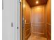 Interior view of the elevator in this home with beautiful wood paneling and tile floor at 11000 8Th E St, Treasure Island, FL 33706