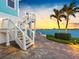 Exterior stairs and waterfront access, enhancing the appeal and convenience of the property at 11000 8Th E St, Treasure Island, FL 33706