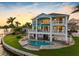 Waterfront home with multiple decks, pool, lush lawn, and dock access at 11000 8Th E St, Treasure Island, FL 33706