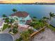 Beautiful waterfront home boasts lush landscaping, a private dock, and serene water views at 11000 8Th E St, Treasure Island, FL 33706