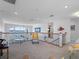 Loft area overlooking the water with decorative railings, fish decor, and a piano at 11000 8Th E St, Treasure Island, FL 33706