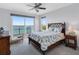 Cozy bedroom with water view access, adorned with a decorative bed and coastal-themed decor at 11000 8Th E St, Treasure Island, FL 33706