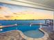 Inviting outdoor pool area with stunning waterfront views, ideal for relaxation and entertainment at 11000 8Th E St, Treasure Island, FL 33706