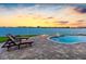 Relaxing outdoor pool area with comfortable lounge chairs, perfect for soaking up the sun at 11000 8Th E St, Treasure Island, FL 33706
