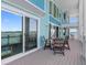 Inviting porch with patio set offers an open space and a beautiful view of the water at 11000 8Th E St, Treasure Island, FL 33706