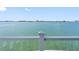 Serene water view from balcony featuring clear railing and tranquil blue waters at 11000 8Th E St, Treasure Island, FL 33706