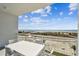 A private outdoor balcony offers panoramic views of the pristine beach and sparkling ocean at 11500 Gulf Blvd # 513, Treasure Island, FL 33706