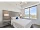Well lit bedroom with gray headboard and a large window with city views at 11500 Gulf Blvd # 513, Treasure Island, FL 33706