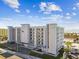 Stunning exterior of a modern beachfront condo building, boasting clean lines, balconies, and coastal charm at 11500 Gulf Blvd # 513, Treasure Island, FL 33706