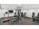 Well-equipped gym featuring modern workout equipment and a flat screen television for an enhanced fitness experience at 11500 Gulf Blvd # 513, Treasure Island, FL 33706