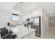 Well-equipped kitchen with a sleek breakfast bar, stainless steel appliances, and modern lighting at 11500 Gulf Blvd # 513, Treasure Island, FL 33706
