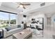 Light filled living room with kitchen island, modern finishes, and stainless steel appliances at 11500 Gulf Blvd # 513, Treasure Island, FL 33706