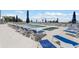 Inviting pool area with lounge chairs, umbrellas, and relaxing spa, a perfect oasis for residents and guests at 11500 Gulf Blvd # 513, Treasure Island, FL 33706