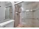 Bathroom showcasing a glass-enclosed shower and modern fixtures at 11974 Rosetree S Pl, Seminole, FL 33772