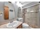 Bathroom showcasing a glass-enclosed shower and modern fixtures at 11974 Rosetree S Pl, Seminole, FL 33772