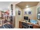 Comfortable home office features a built-in desk and wood cabinets for storage at 11974 Rosetree S Pl, Seminole, FL 33772