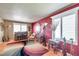Comfortable living room with decorative rug, ample natural light, and stylish furnishings at 11974 Rosetree S Pl, Seminole, FL 33772