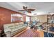 Cozy loft area with comfortable seating, unique decorative touches, and plenty of natural light at 11974 Rosetree S Pl, Seminole, FL 33772