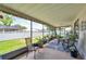 This screened patio provides a comfortable retreat with garden views at 11974 Rosetree S Pl, Seminole, FL 33772