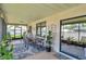 Comfortable screened patio offers peaceful outdoor relaxation and dining at 11974 Rosetree S Pl, Seminole, FL 33772