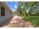 Spacious outdoor patio area, perfect for entertaining with views of the screened-in lanai and grassy backyard at 12510 Sparkleberry Rd, Tampa, FL 33626