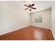 Comfortable bedroom featuring ceiling fan, natural light, and laminate wood floors at 12510 Sparkleberry Rd, Tampa, FL 33626