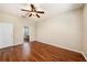 Bedroom boasts laminate floors, ceiling fan, and an en-suite bathroom at 12510 Sparkleberry Rd, Tampa, FL 33626