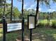 Westwood Lakes community notice board with tennis courts in the background at 12510 Sparkleberry Rd, Tampa, FL 33626