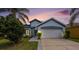 Charming single Gathering home with a two-car garage and well-maintained landscaping at 12510 Sparkleberry Rd, Tampa, FL 33626