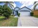 Charming single Gathering home with a two-car garage and well-maintained landscaping at 12510 Sparkleberry Rd, Tampa, FL 33626