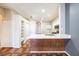 Well-appointed kitchen featuring quartz countertop and breakfast bar at 12510 Sparkleberry Rd, Tampa, FL 33626