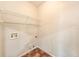 A utility room featuring built in storage shelves, wall mounted outlet boxes and decorative tile flooring at 12510 Sparkleberry Rd, Tampa, FL 33626