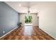 Spacious living room features tile flooring, a ceiling fan, and sliding glass doors at 12510 Sparkleberry Rd, Tampa, FL 33626