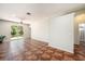 Bright living room features tile flooring, ceiling fan and sliding glass doors to the backyard at 12510 Sparkleberry Rd, Tampa, FL 33626