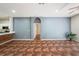 Open-concept living room featuring stylish flooring and modern architectural design at 12510 Sparkleberry Rd, Tampa, FL 33626