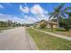 A street view of the neighborhood with well-manicured lawns and mature trees at 12510 Sparkleberry Rd, Tampa, FL 33626