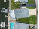 Birds eye view of a home featuring a new roof, boat dock with lift and private pool at 14409 Birch St, Hudson, FL 34667