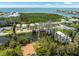Aerial view of waterfront homes with canal access, close to a beautiful open bay view at 14409 Birch St, Hudson, FL 34667