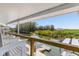 Scenic waterfront views from the back porch featuring a boat dock and boat at 14409 Birch St, Hudson, FL 34667
