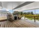 Relaxing waterfront back porch with covered seating area and scenic water views at 14409 Birch St, Hudson, FL 34667