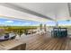 Waterfront back porch with patio furniture and beautiful nature views at 14409 Birch St, Hudson, FL 34667