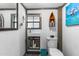 This charming bathroom boasts a modern sink, toilet, and nautical decor, creating a cozy and inviting space at 14409 Birch St, Hudson, FL 34667