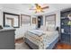 Comfortable bedroom with two windows and coastal decor with a white and blue color scheme at 14409 Birch St, Hudson, FL 34667